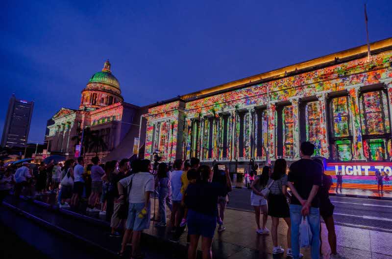 Installation view of Light to Night Singapore, colourful projections on the building facade of National Gallery Singapore