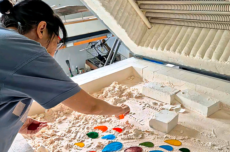 Image of woman coloring her artwork