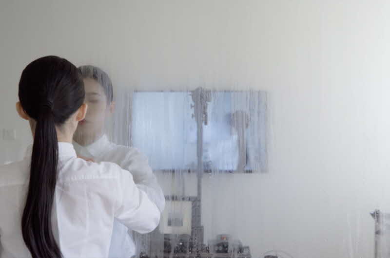 Image of collaborator Vera wiping window