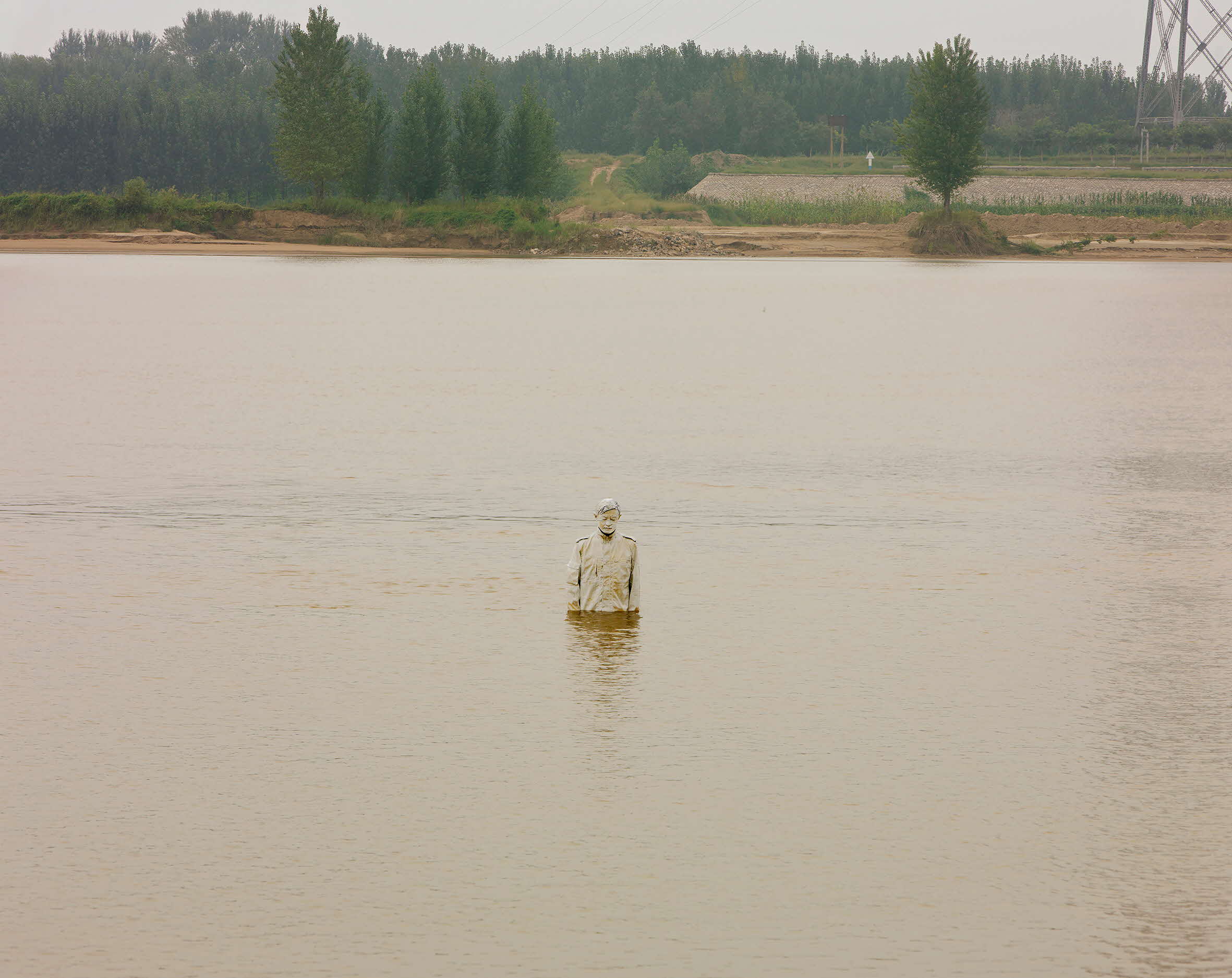 Image of person painted to blend in with the Yellow River