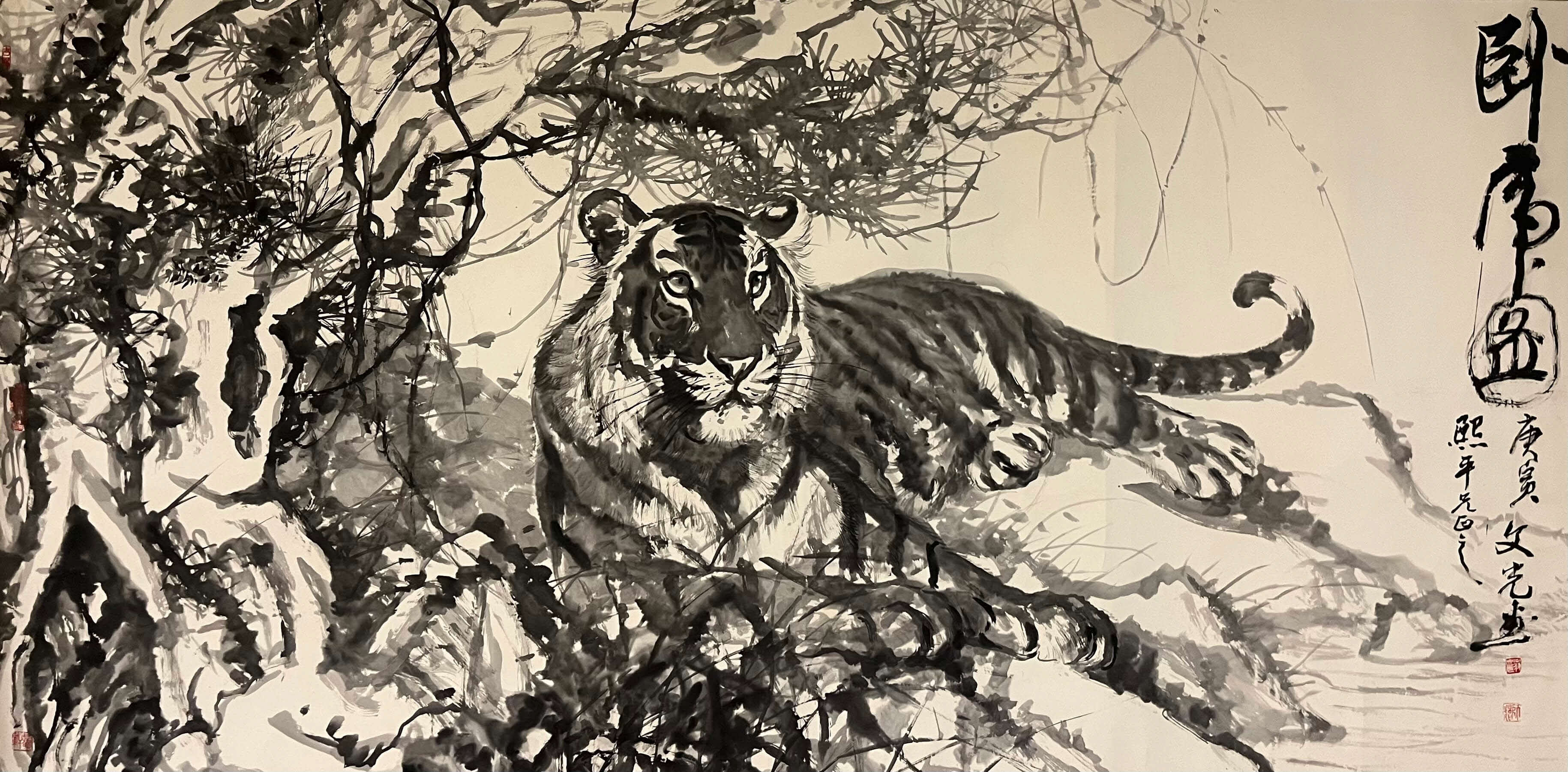 Artwork in sepia tone of a tiger lounging in the forest