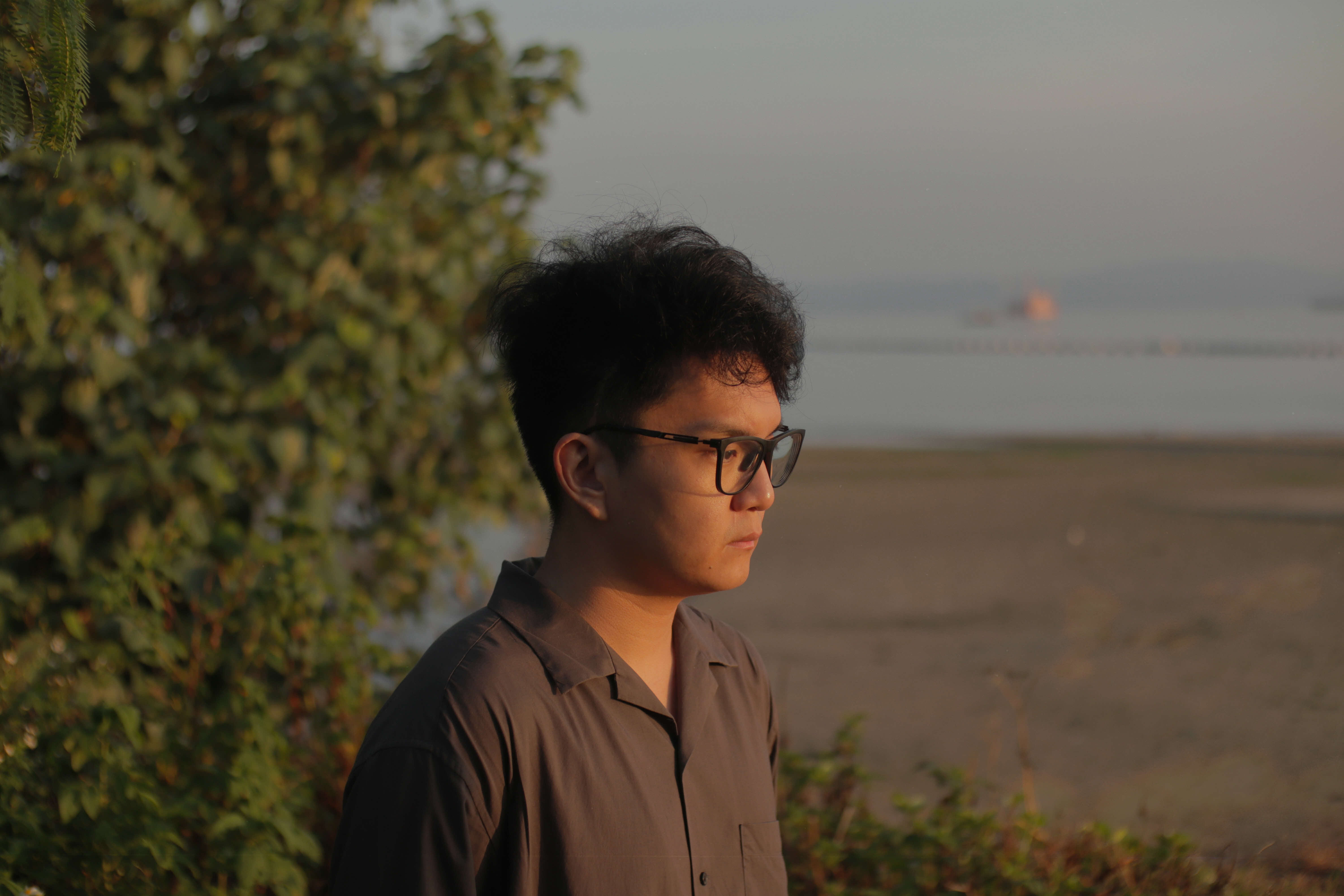 Side profile of young man in glasses