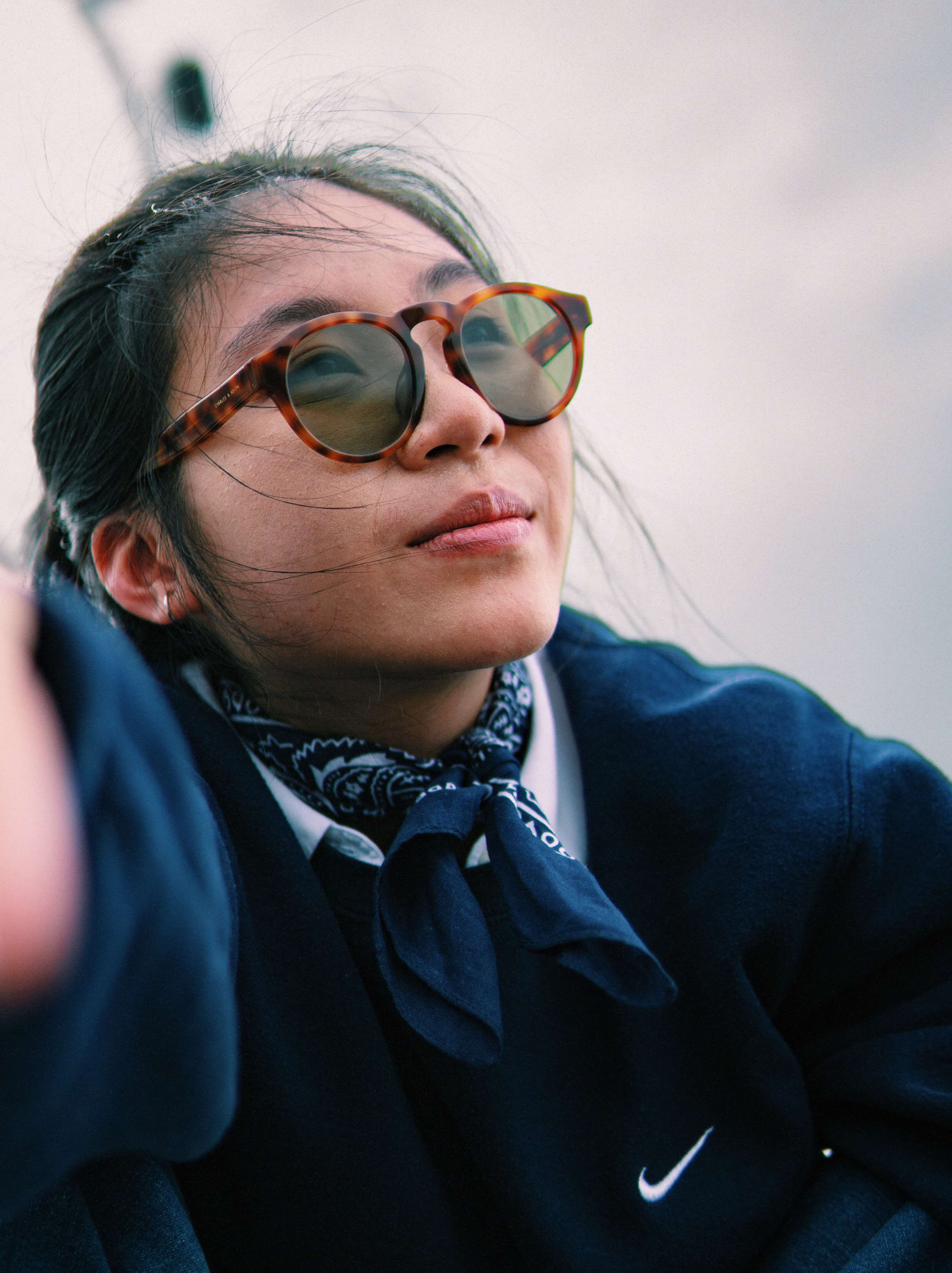 Woman with sunglasses looking afar