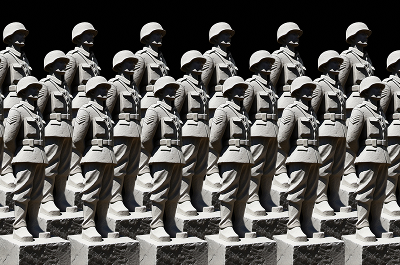 Grey soldier figures standing against a black background