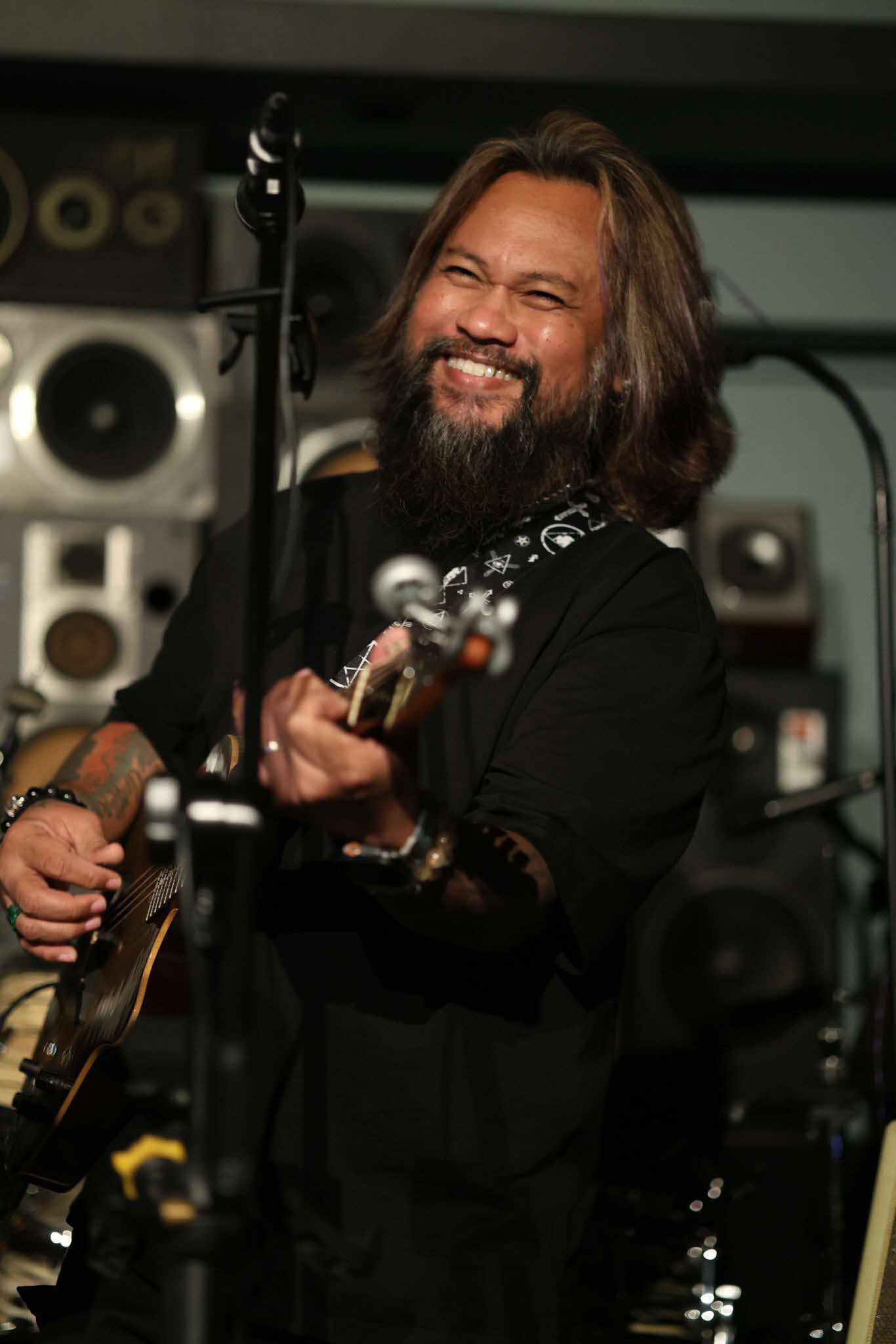 Man playing the guitar on stage